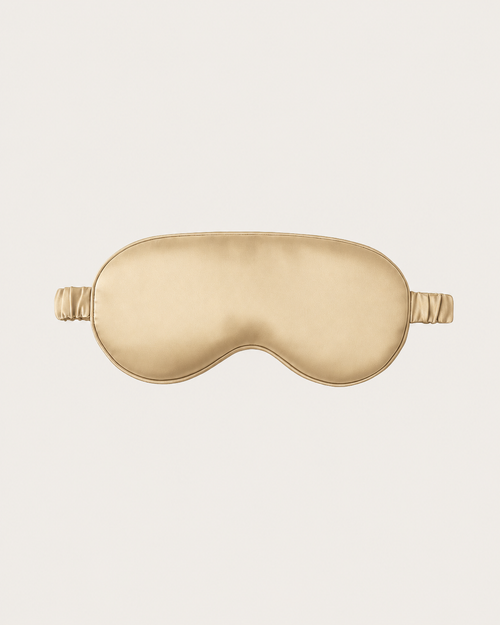 Sand Beige silk sleep mask with a contoured eye shape and elastic side ties