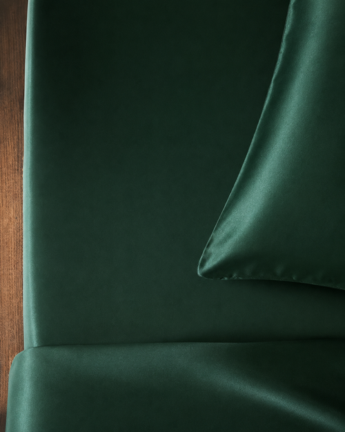 Emerald Green silk fitted sheet corner fold on smooth fabric