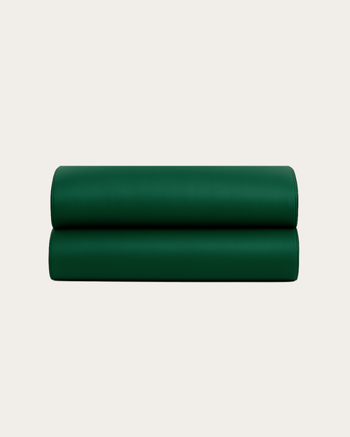Emerald Green silk fitted sheet folded into a smooth stacked set